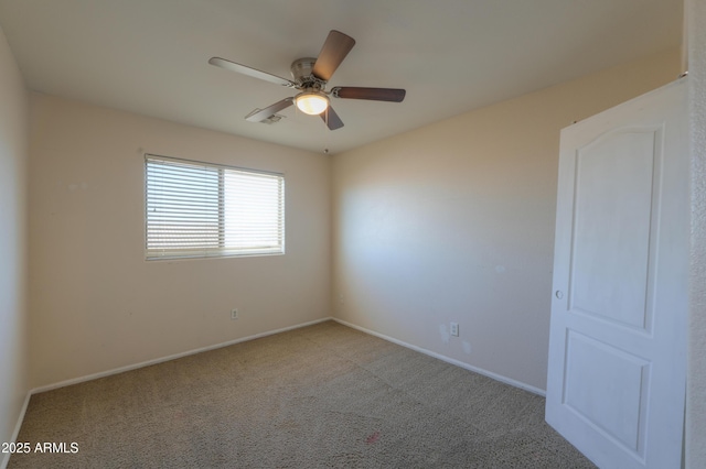 unfurnished room featuring ceiling fan and light colored carpet