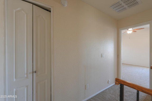 corridor with carpet flooring