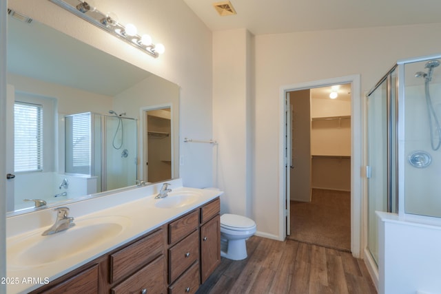 bathroom with lofted ceiling, wood-type flooring, and walk in shower