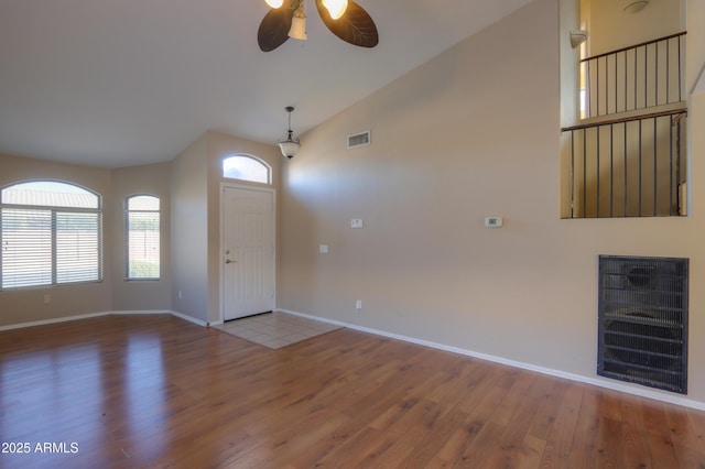 foyer featuring lofted ceiling, ceiling fan, and hardwood / wood-style flooring