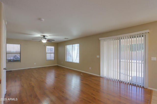 spare room featuring ceiling fan and hardwood / wood-style floors