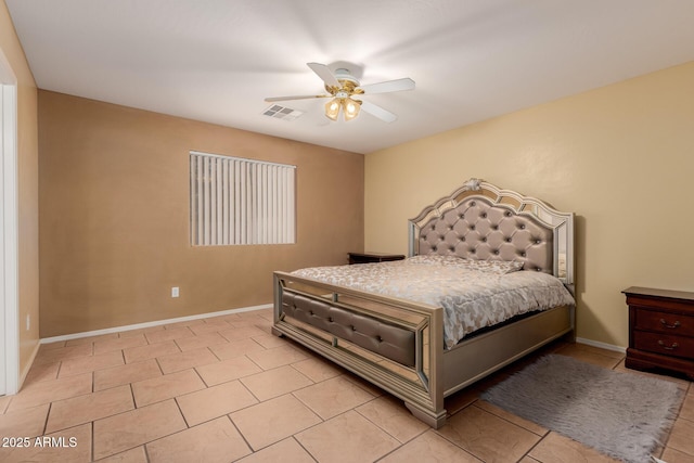 bedroom featuring baseboards, visible vents, ceiling fan, and light tile patterned flooring