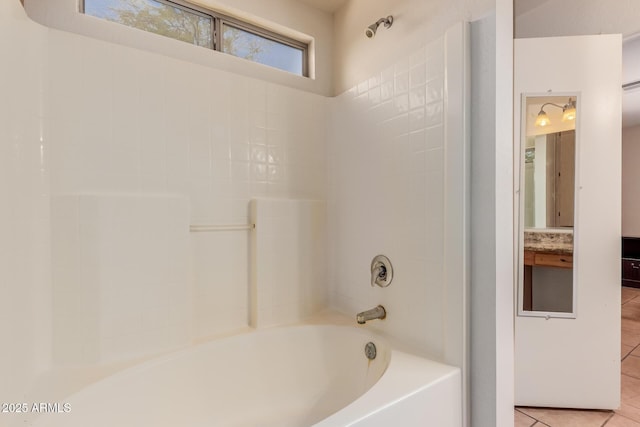 bathroom featuring shower / washtub combination and tile patterned flooring