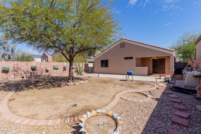 view of yard featuring a patio area and a fenced backyard