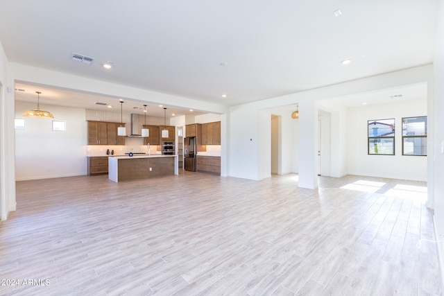 unfurnished living room featuring light hardwood / wood-style flooring