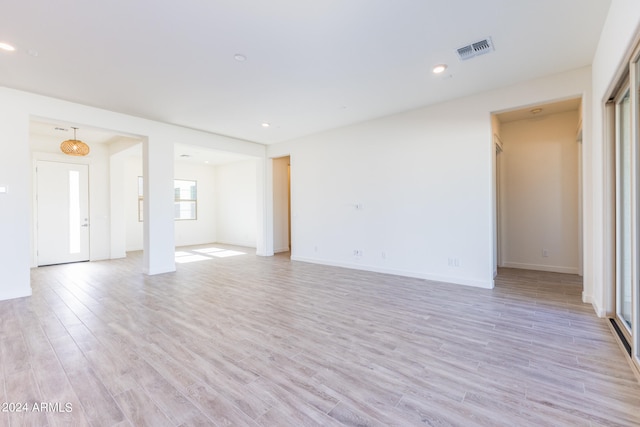 unfurnished room featuring light hardwood / wood-style flooring