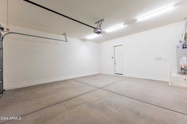 garage featuring a garage door opener and gas water heater