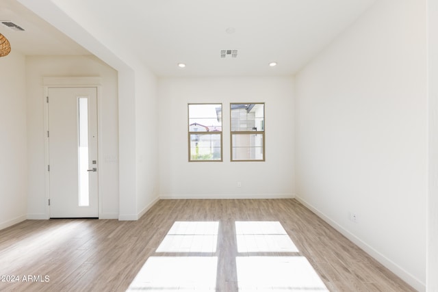 unfurnished room featuring light hardwood / wood-style flooring