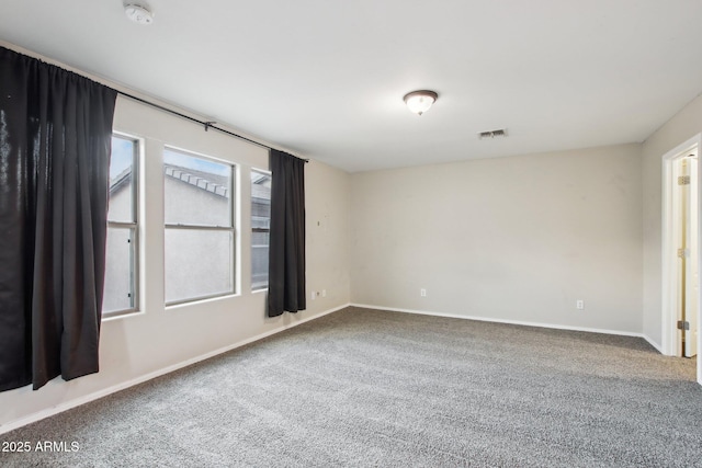 spare room featuring carpet floors