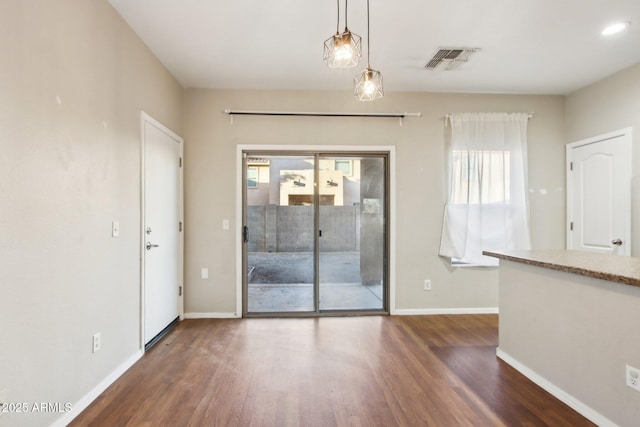 empty room with dark hardwood / wood-style floors