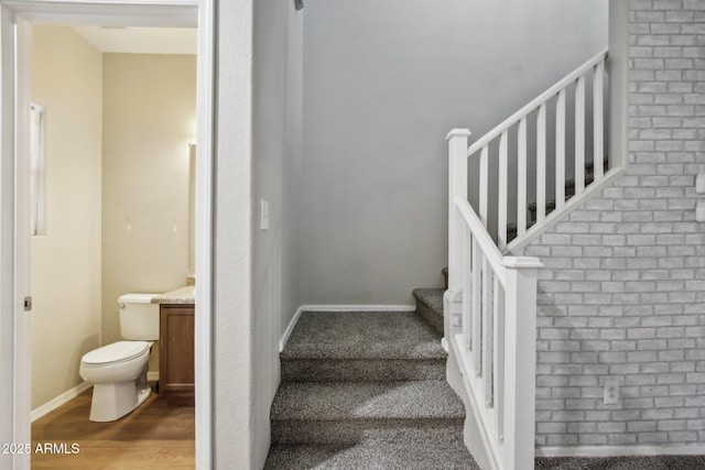 stairway featuring hardwood / wood-style floors