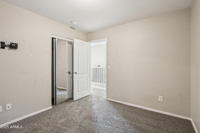 unfurnished bedroom with carpet floors and a closet