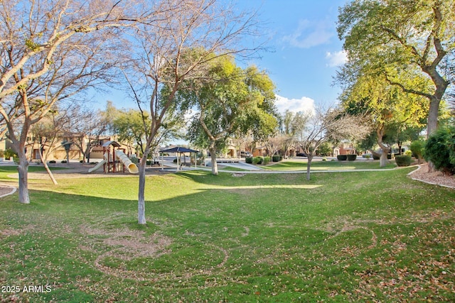 view of community with a yard and a playground