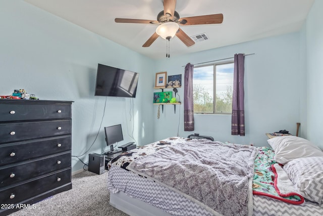 bedroom featuring visible vents, carpet floors, baseboards, and a ceiling fan