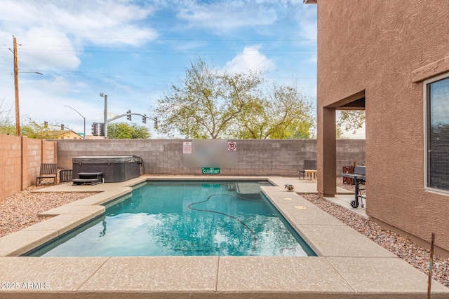 view of pool with a patio area, a fenced backyard, and a hot tub