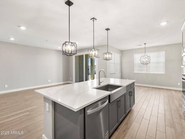 17809 W Elm St, Goodyear, AZ 85395 - kitchen featuring a sink, a chandelier, stainless steel dishwasher, light wood-style floors, and recessed lighting