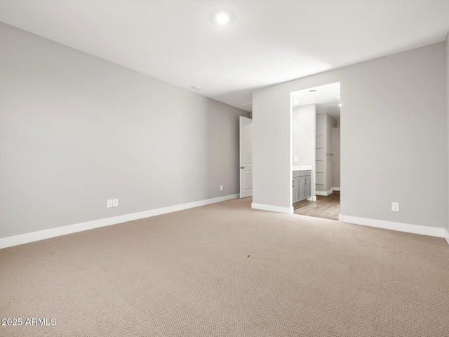 17809 W Elm St, Goodyear, AZ 85395 - empty room featuring light colored carpet, baseboards, and recessed lighting