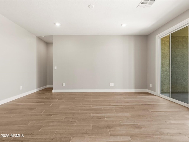17809 W Elm St, Goodyear, AZ 85395 - unfurnished room with light wood finished floors, baseboards, and recessed lighting