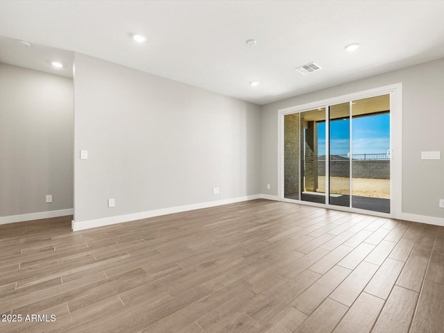 17809 W Elm St, Goodyear, AZ 85395 - unfurnished room featuring wood finished floors, baseboards, and recessed lighting