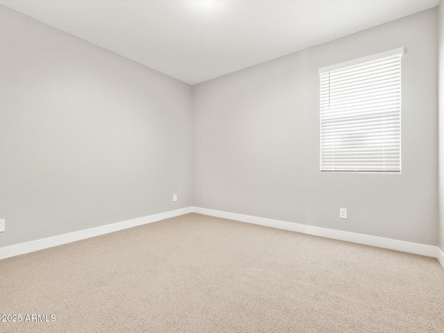 17809 W Elm St, Goodyear, AZ 85395 - empty room featuring baseboards and carpet