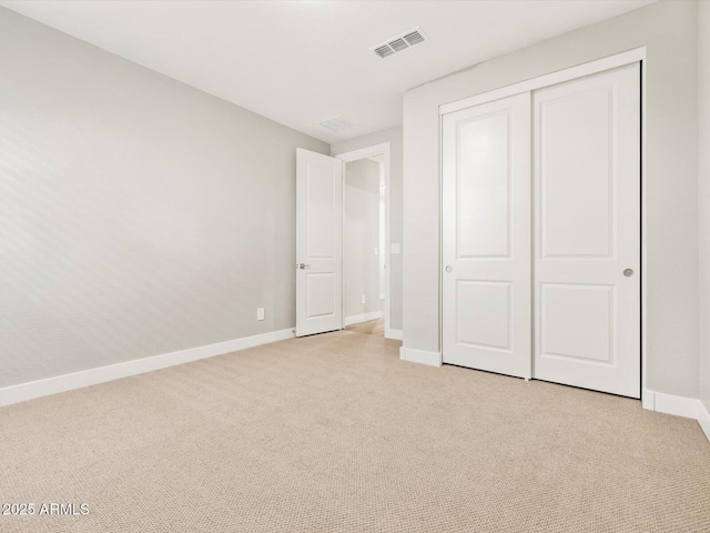 17809 W Elm St, Goodyear, AZ 85395 - unfurnished bedroom with light carpet, baseboards, and a closet