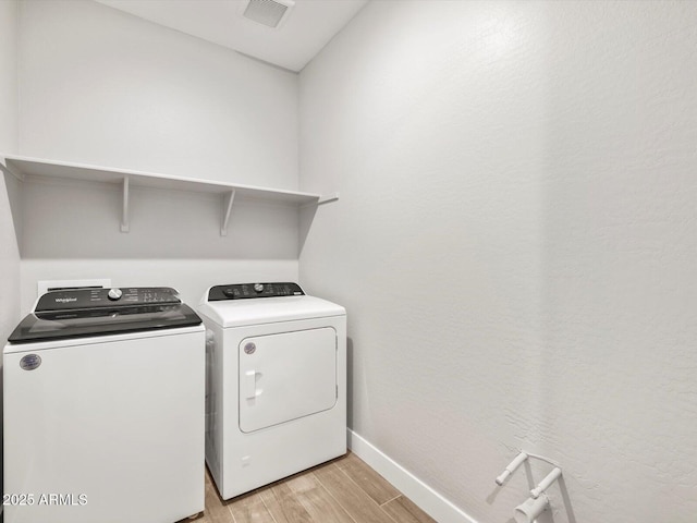 17809 W Elm St, Goodyear, AZ 85395 - laundry area with separate washer and dryer, light wood-style flooring, and baseboards