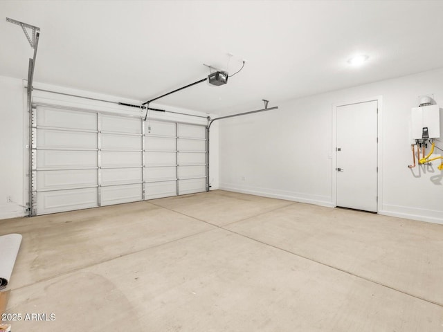 17809 W Elm St, Goodyear, AZ 85395 - garage featuring a garage door opener, water heater, and baseboards
