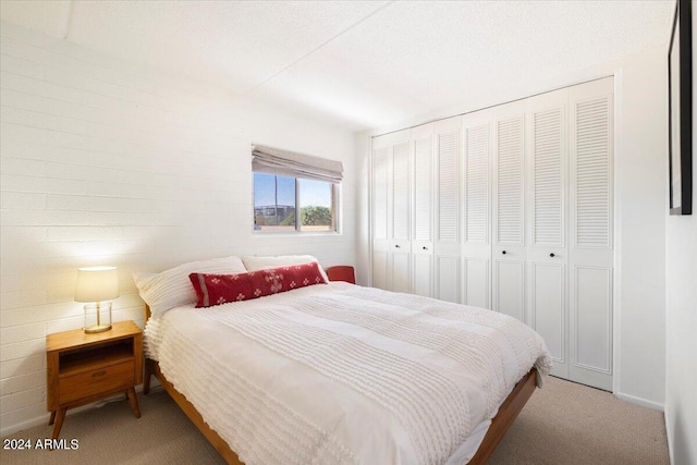 bedroom with carpet floors and a closet