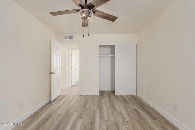 unfurnished bedroom featuring a closet, ceiling fan, and light wood-type flooring