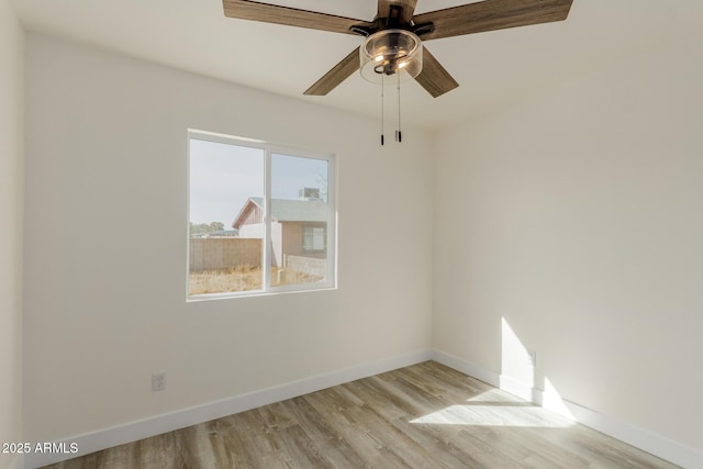 spare room with light hardwood / wood-style floors and ceiling fan