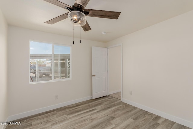 unfurnished room featuring ceiling fan and light hardwood / wood-style flooring