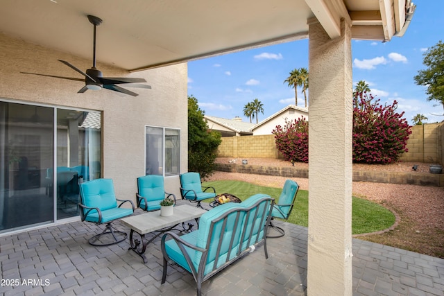 view of patio / terrace featuring ceiling fan