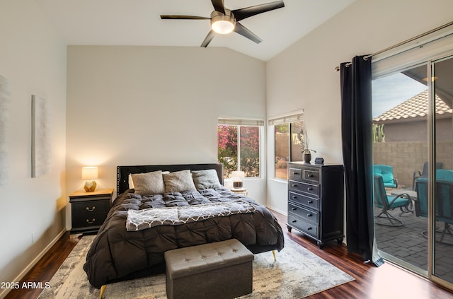 bedroom featuring dark hardwood / wood-style flooring, vaulted ceiling, and ceiling fan