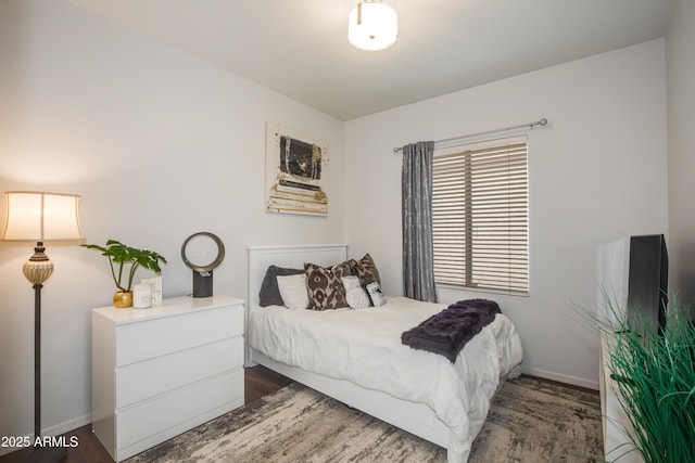 bedroom featuring dark hardwood / wood-style flooring