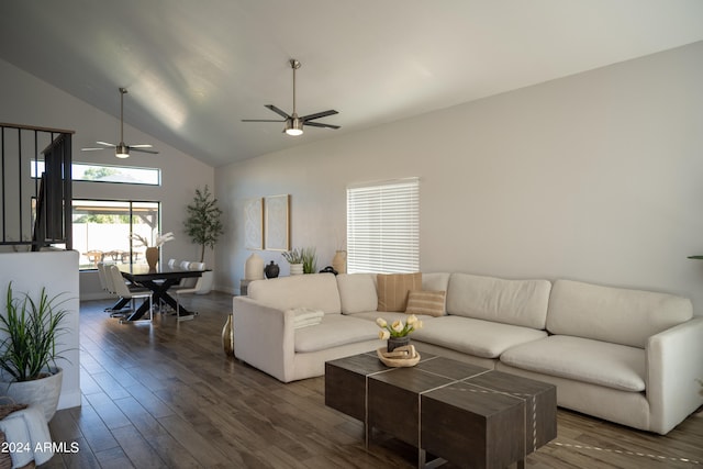 living room with ceiling fan, high vaulted ceiling, and dark hardwood / wood-style flooring