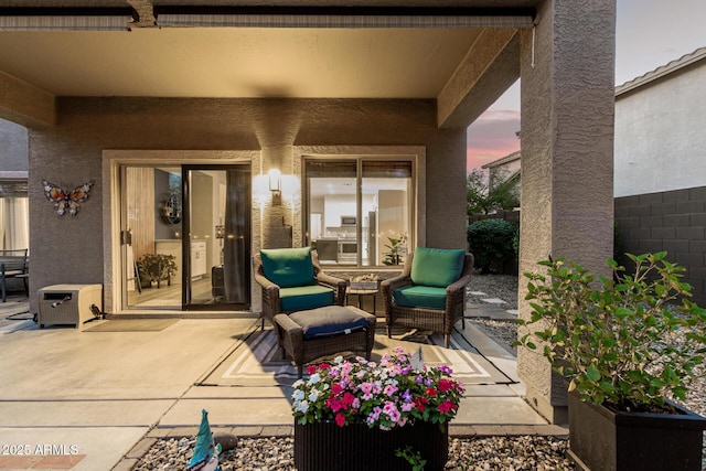 40807 N Barnum Way, Anthem, AZ 85086 - patio terrace at dusk featuring a patio and outdoor lounge area