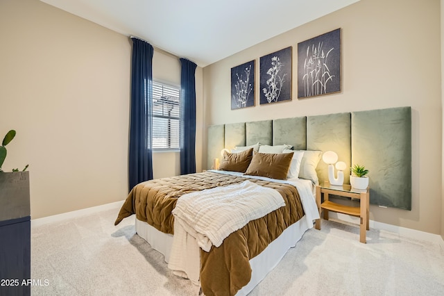carpeted bedroom featuring baseboards