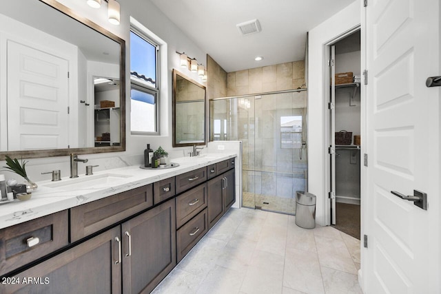 bathroom featuring vanity and walk in shower