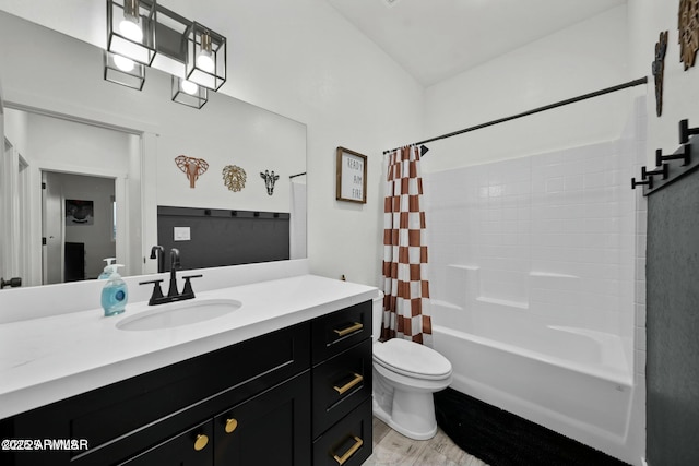 full bathroom featuring vanity, toilet, shower / tub combo, and hardwood / wood-style floors