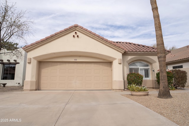 mediterranean / spanish-style home featuring a garage