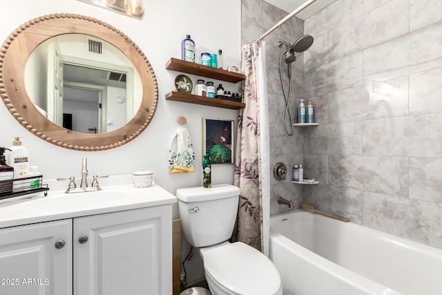bathroom with shower / tub combo with curtain, vanity, visible vents, and toilet