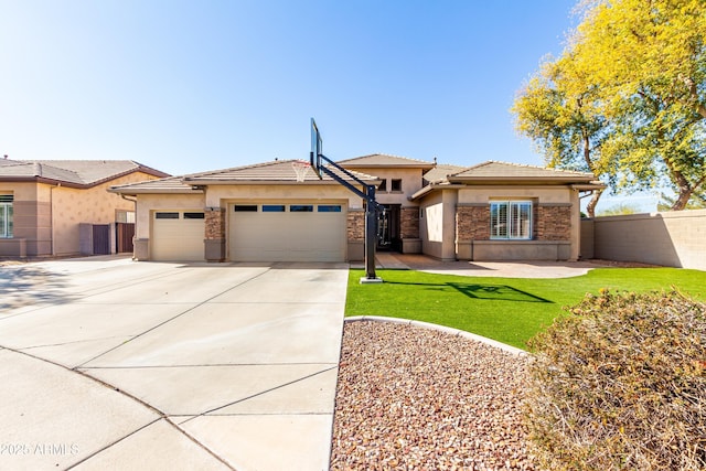 view of front of home featuring a garage and a front yard