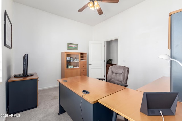 carpeted office featuring ceiling fan