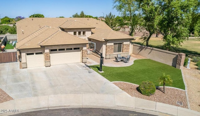 view of front facade with a garage, a patio area, and a front lawn