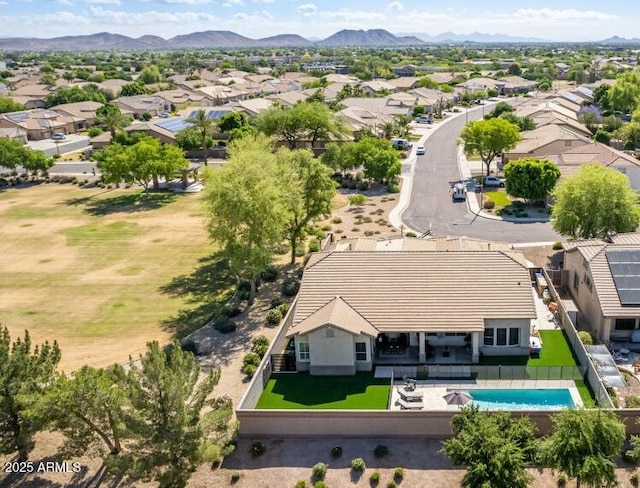 birds eye view of property with a mountain view