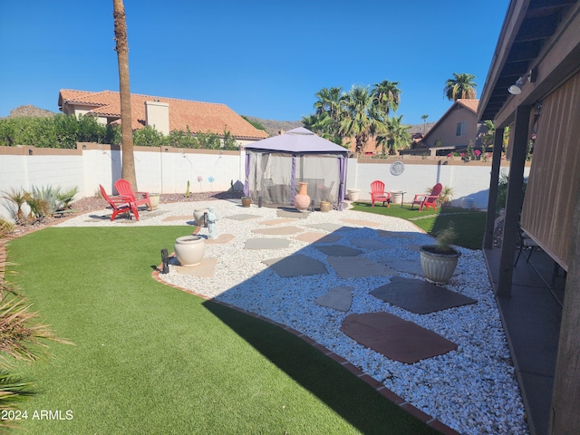 view of yard with a patio and a gazebo