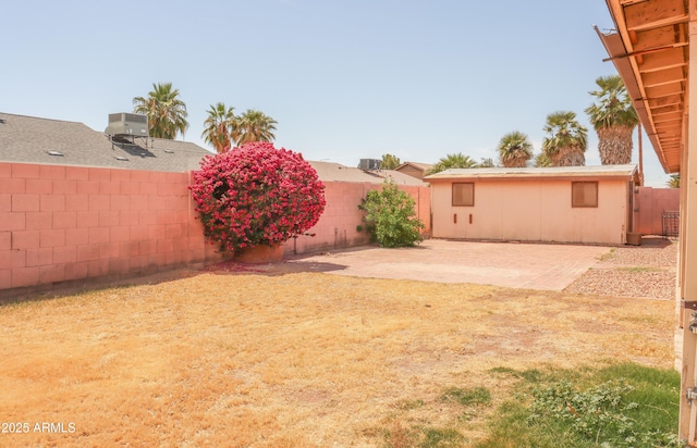 view of yard with a fenced backyard and a patio area