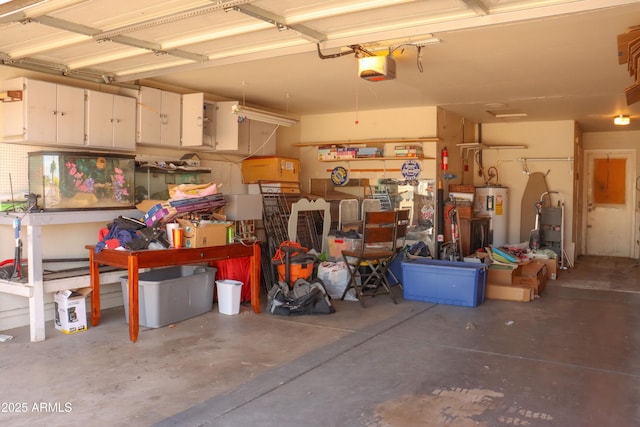 garage featuring a garage door opener, a workshop area, and electric water heater