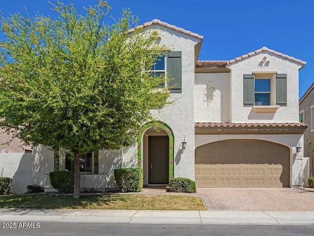 970 W Zion Way, Chandler, AZ 85248 - mediterranean / spanish-style house featuring a tiled roof, a garage, stucco siding, and decorative driveway