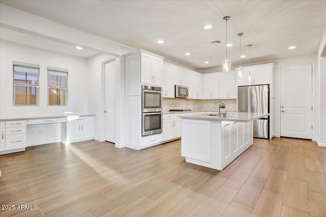 970 W Zion Way, Chandler, AZ 85248 - kitchen featuring appliances with stainless steel finishes, light countertops, white cabinets, and recessed lighting
